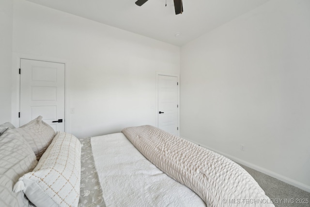 carpeted bedroom featuring baseboards and ceiling fan