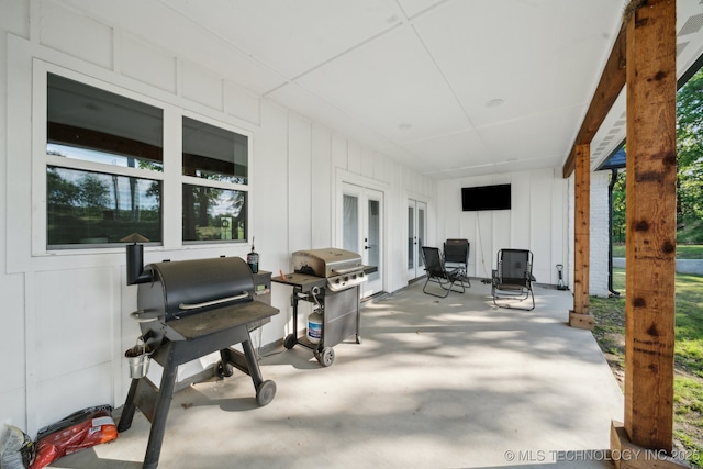 view of patio featuring french doors and a grill