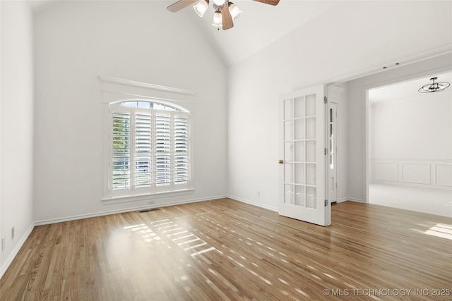 9624 S 68th E Ave, Tulsa, OK 74133 - spare room featuring high vaulted ceiling, a ceiling fan, visible vents, and wood finished floors