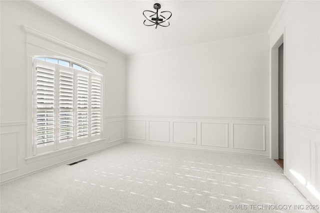9624 S 68th E Ave, Tulsa, OK 74133 - unfurnished room with a decorative wall, ornamental molding, a notable chandelier, and visible vents