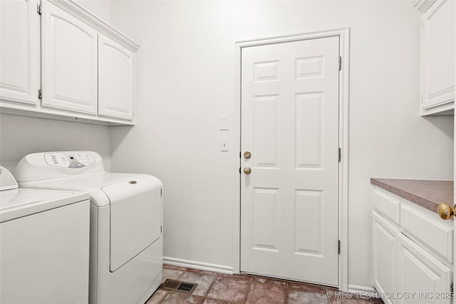 9624 S 68th E Ave, Tulsa, OK 74133 - washroom with baseboards, cabinet space, and washer and clothes dryer