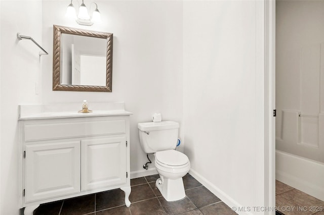 9624 S 68th E Ave, Tulsa, OK 74133 - full bathroom with toilet, baseboards, tile patterned flooring, and vanity