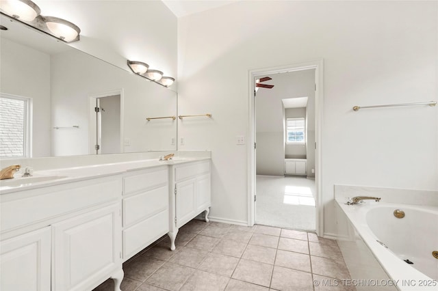 9624 S 68th E Ave, Tulsa, OK 74133 - bathroom featuring tile patterned floors, double vanity, a bath, and a sink