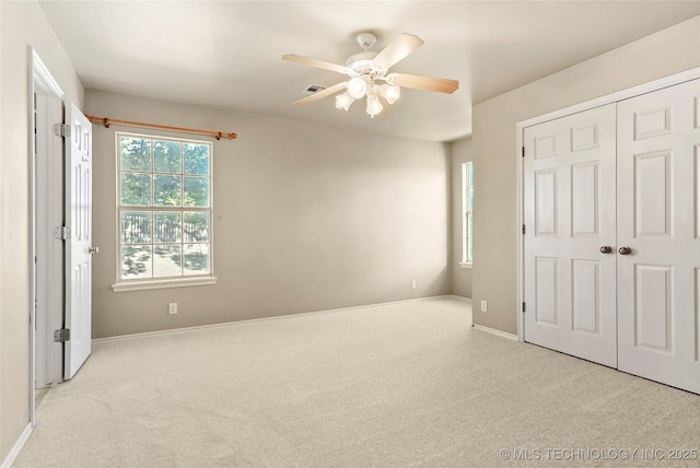 9624 S 68th E Ave, Tulsa, OK 74133 - unfurnished bedroom featuring carpet, a closet, baseboards, and a ceiling fan