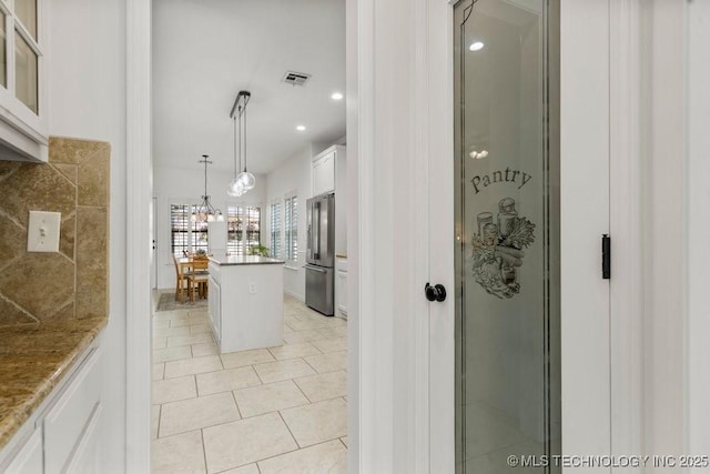 6811 S Sycamore Pl, Broken Arrow, OK 74011 - corridor featuring recessed lighting and light tile patterned flooring