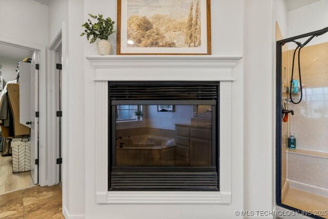 6811 S Sycamore Pl, Broken Arrow, OK 74011 - detailed view of a glass covered fireplace