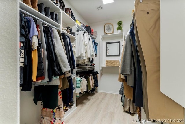 6811 S Sycamore Pl, Broken Arrow, OK 74011 - spacious closet featuring wood finished floors