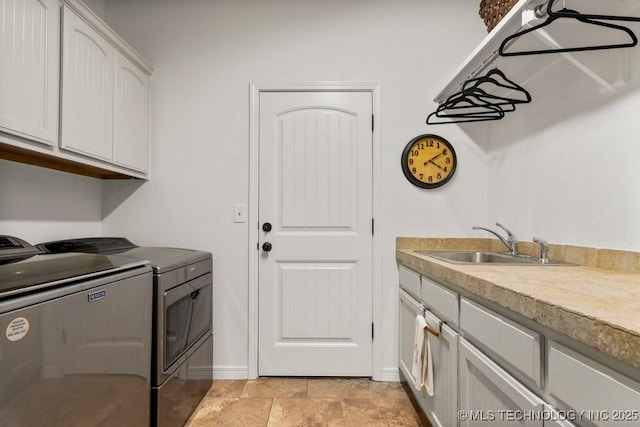 6811 S Sycamore Pl, Broken Arrow, OK 74011 - clothes washing area with washing machine and clothes dryer, cabinet space, and baseboards