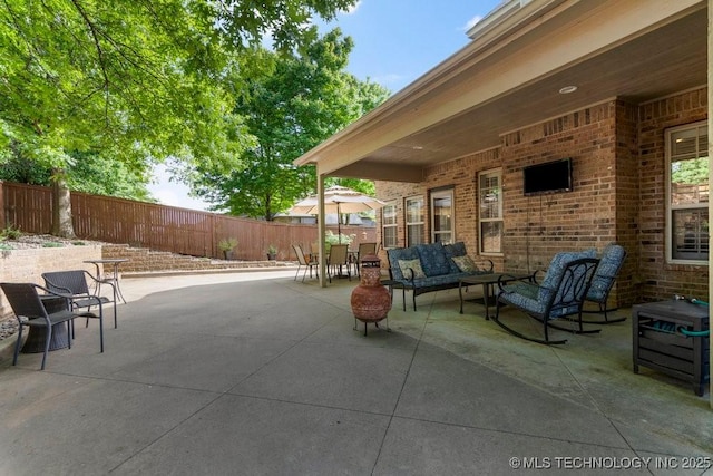 6811 S Sycamore Pl, Broken Arrow, OK 74011 - view of patio featuring outdoor lounge area and a fenced backyard