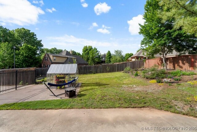 6811 S Sycamore Pl, Broken Arrow, OK 74011 - view of yard featuring an exterior structure, an outbuilding, and a patio