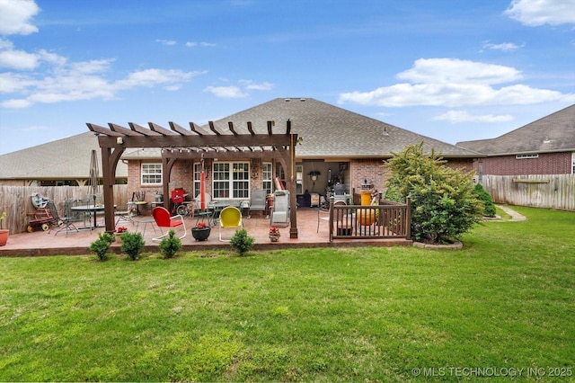 back of property featuring a pergola, a patio, and brick siding