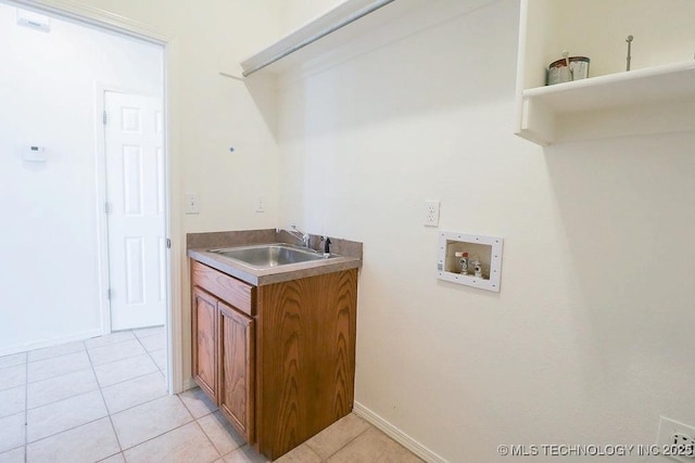 3934 S 199th E Ave, Broken Arrow, OK 74014 - laundry area featuring washer hookup, light tile patterned floors, and cabinet space
