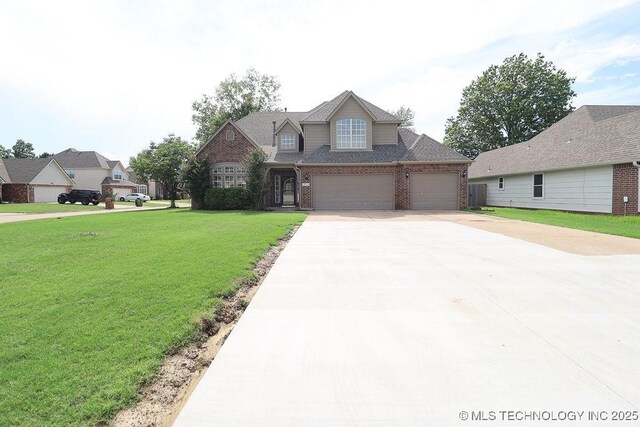 3934 S 199th E Ave, Broken Arrow, OK 74014 - traditional-style home with brick siding, concrete driveway, a front yard, and a garage
