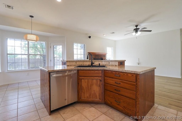 3934 S 199th E Ave, Broken Arrow, OK 74014 - kitchen featuring stainless steel dishwasher, brown cabinets, a ceiling fan, light countertops, and decorative light fixtures