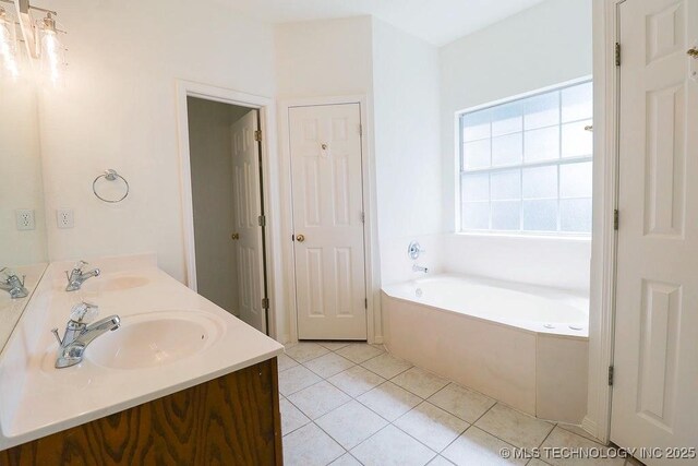 3934 S 199th E Ave, Broken Arrow, OK 74014 - bathroom featuring a bath, tile patterned floors, and double vanity