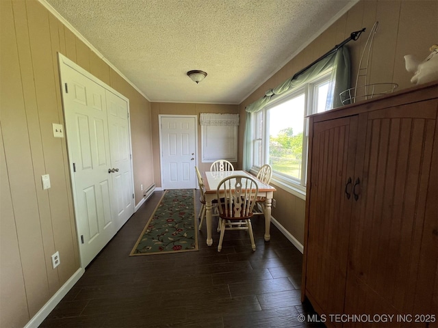 105 Hinton Blvd, Mannford, OK 74044 - dining space with crown molding, a textured ceiling, dark wood-type flooring, and baseboards