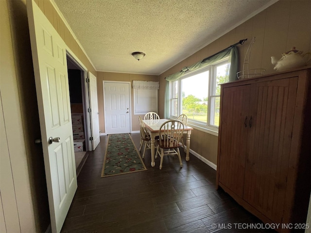 105 Hinton Blvd, Mannford, OK 74044 - dining room featuring a textured ceiling, baseboards, and wood finished floors