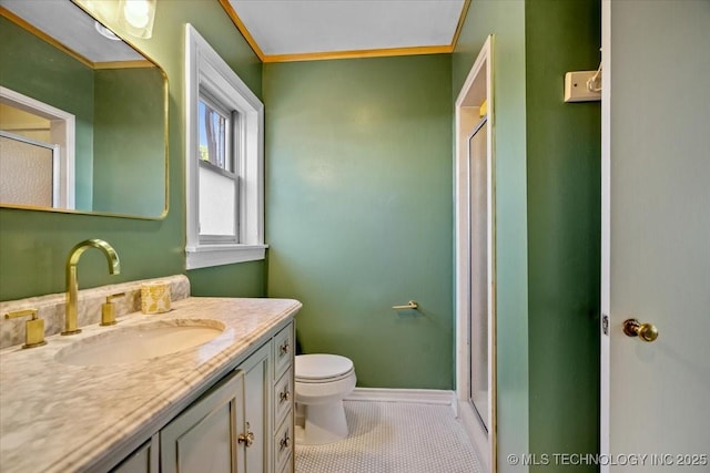 bathroom featuring tile patterned flooring, toilet, a shower stall, and vanity