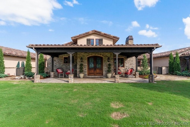 9639 Horizon Cir, Sperry, OK 74073 - rear view of house with a lawn, a chimney, and a tiled roof