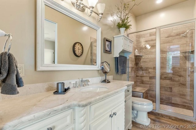 9639 Horizon Cir, Sperry, OK 74073 - full bath featuring vanity, toilet, a shower stall, and wood finished floors