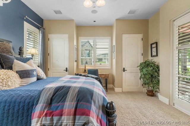 9639 Horizon Cir, Sperry, OK 74073 - carpeted bedroom featuring baseboards, multiple windows, and visible vents