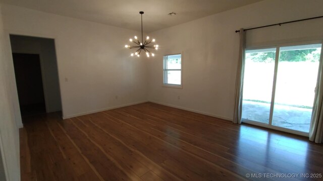 21316 County Road 502, Colcord, OK 74338 - empty room with baseboards, an inviting chandelier, and wood-type flooring