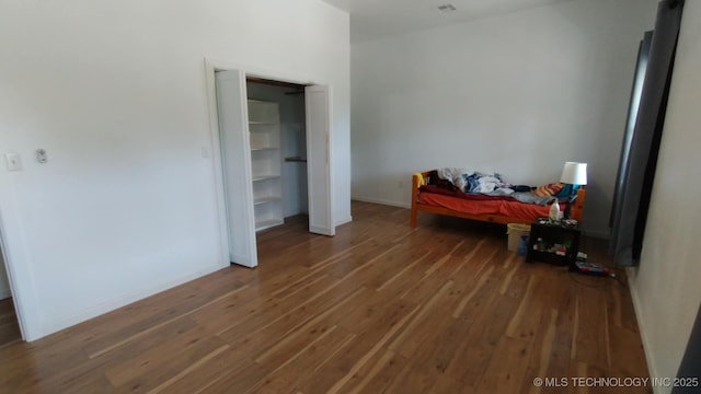 21316 County Road 502, Colcord, OK 74338 - bedroom featuring wood finished floors and baseboards
