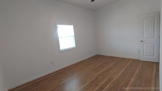 21316 County Road 502, Colcord, OK 74338 - unfurnished room featuring wood finished floors, baseboards, and ceiling fan