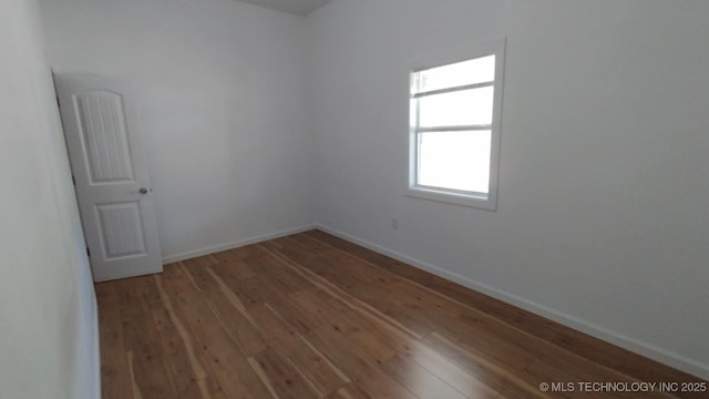 21316 County Road 502, Colcord, OK 74338 - spare room with hardwood / wood-style flooring and baseboards