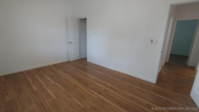 21316 County Road 502, Colcord, OK 74338 - spare room with wood finished floors and baseboards