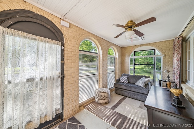 1731 S Florence Pl, Tulsa, OK 74104 - sunroom with plenty of natural light, visible vents, and brick wall