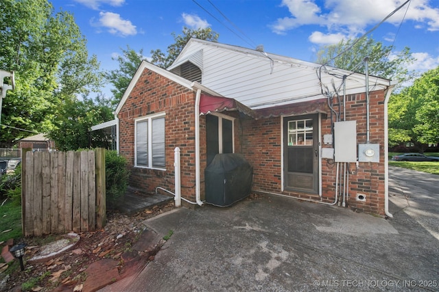 1731 S Florence Pl, Tulsa, OK 74104 - view of front of house featuring brick siding and fence