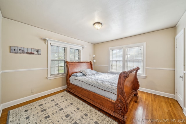 1731 S Florence Pl, Tulsa, OK 74104 - bedroom with baseboards and wood finished floors