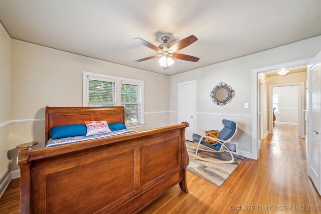 1731 S Florence Pl, Tulsa, OK 74104 - bedroom featuring baseboards, a ceiling fan, visible vents, and light wood-style floors