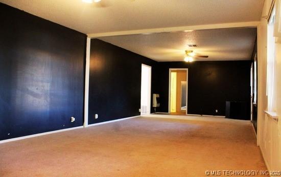 107 S 10th, Davis, OK 73030 - unfurnished room featuring carpet flooring and ceiling fan