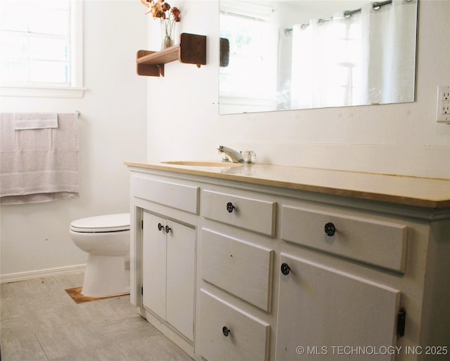 107 S 10th, Davis, OK 73030 - bathroom with vanity, healthy amount of natural light, and curtained shower