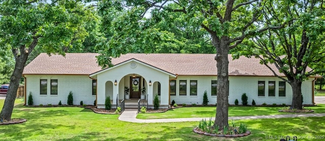 1402 E 125th St S, Jenks, OK 74037 - ranch-style house with a porch, a front lawn, and brick siding
