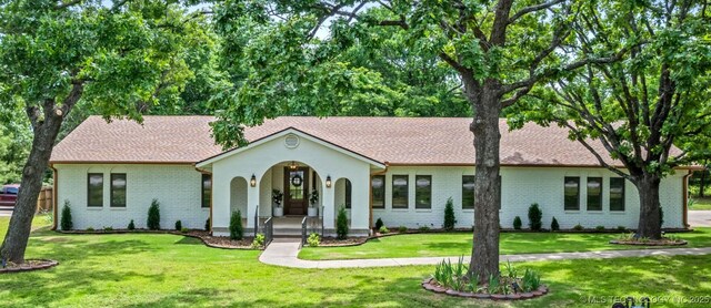 1402 E 125th St S, Jenks, OK 74037 - ranch-style home with covered porch, a front yard, and brick siding