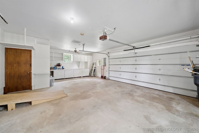1402 E 125th St S, Jenks, OK 74037 - garage featuring a garage door opener and electric panel