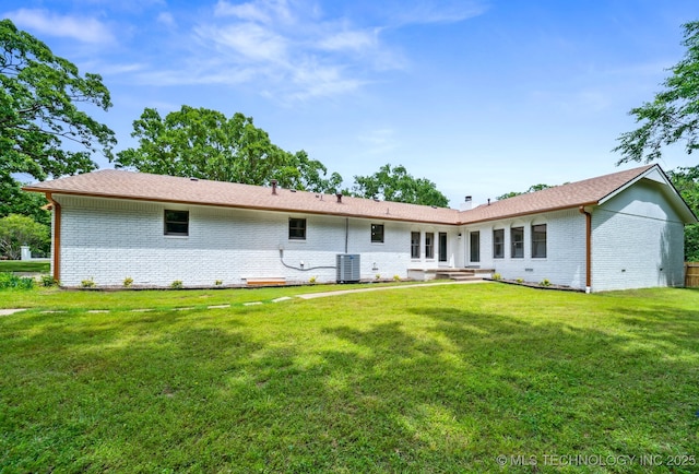 1402 E 125th St S, Jenks, OK 74037 - back of house featuring brick siding, a lawn, and central air condition unit