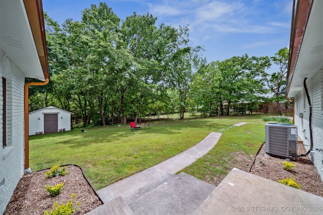1402 E 125th St S, Jenks, OK 74037 - view of green lawn with central AC unit, a shed, and an outdoor structure