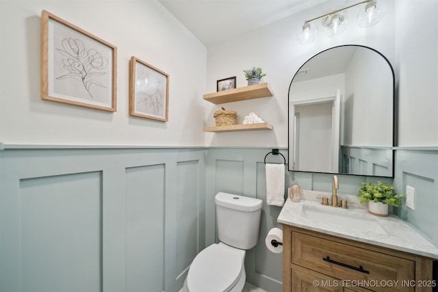 1402 E 125th St S, Jenks, OK 74037 - half bath with a decorative wall, toilet, a wainscoted wall, and vanity