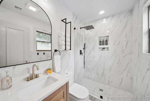 1402 E 125th St S, Jenks, OK 74037 - full bathroom featuring toilet, vanity, a marble finish shower, and tile walls