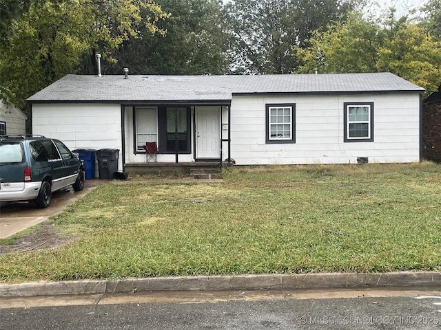 3149 N Hartford Ave, Tulsa, OK 74106 - ranch-style house with a front yard, a garage, a porch, and concrete driveway