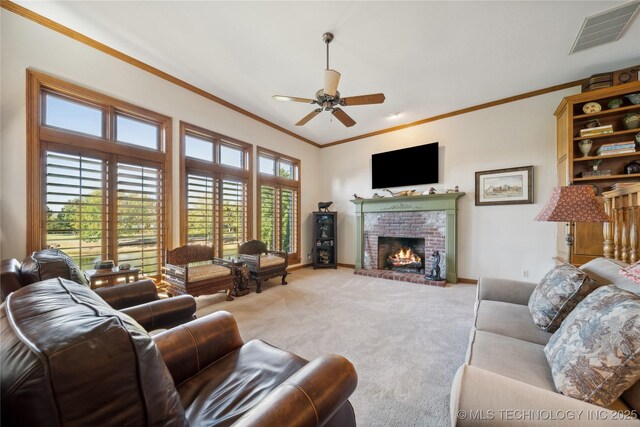 5263 Oak Leaf Dr, Tulsa, OK 74131 - living room with crown molding, carpet floors, a ceiling fan, baseboards, and a brick fireplace