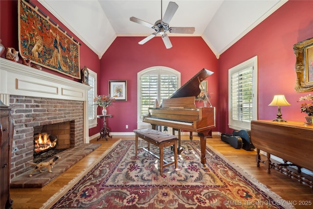 5263 Oak Leaf Dr, Tulsa, OK 74131 - living area featuring lofted ceiling, wood finished floors, plenty of natural light, a ceiling fan, and crown molding