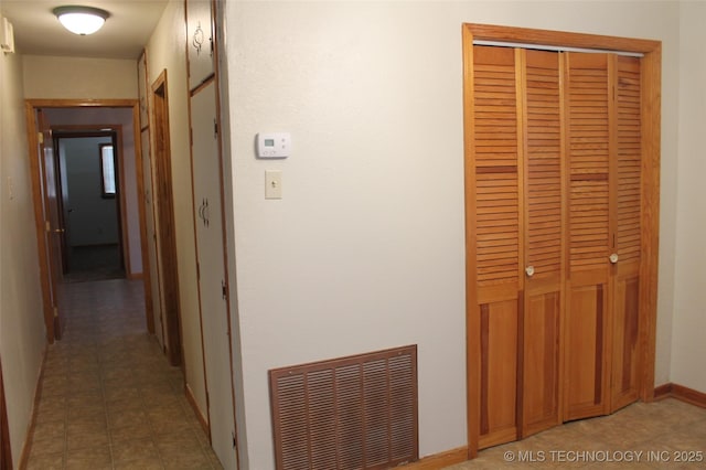 611 Kali Inla, Hartshorne, OK 74547 - corridor with light tile patterned flooring and baseboards