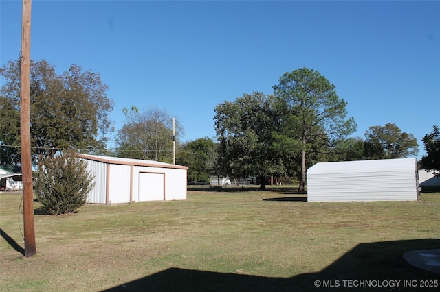611 Kali Inla, Hartshorne, OK 74547 - view of green lawn featuring a garage and an outdoor structure