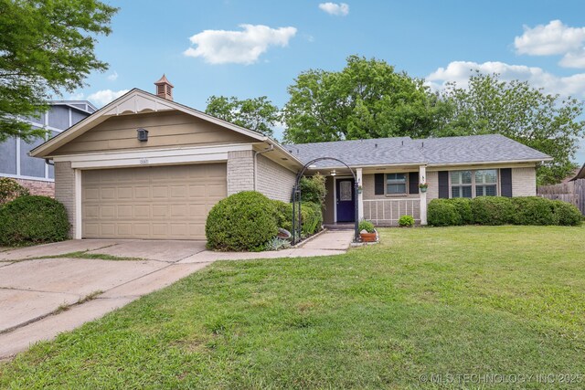 single story home featuring brick siding, concrete driveway, and an attached garage