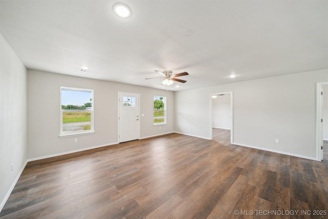 112 E Loy Ave, Chouteau, OK 74337 - unfurnished living room with ceiling fan, dark wood-style floors, and recessed lighting